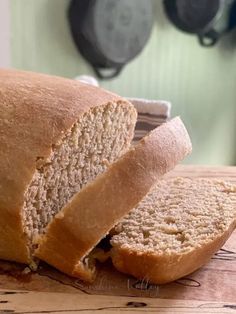 a loaf of bread sitting on top of a wooden cutting board