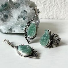 Handmade sterling silver jewelry set for women and girls. The set includes a ring and earrings. The stones are raw fluorite in green color. The pear shape of the fluorite stone and the design of this set are eye-catching. You can wear this set both every day, and on special days. If you are looking for the best gift idea and want unique and not mass-produced jewelry, you are in the right place.  e offer only high-quality and exclusive designs with only natural stones and minerals.  By custom ord Green Sterling Silver Jewelry With Raw Stone, Silver Fluorite Jewelry With Natural Stones, Silver Fluorite Jewelry As A Gift, Silver Fluorite Gemstone Jewelry, Silver Fluorite For Jewelry Making, Green Stone Jewelry, Fluorite Ring, Raw Fluorite, Copper Plating