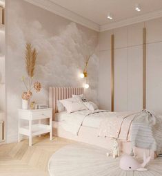 a bedroom decorated in pink and white with a large wallpapered mural behind the bed