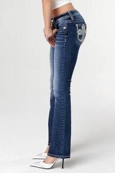 Mid-rise, medium dark-wash bootcut jeans- Embroidered cross with leather insert outling- Floral design accentuated with sequin detailing- Bold-stitched borders and cross interiors with rhinestone rivets and faux pearls- Embossed white leather cross Miss Me brand patch with matching floral embroidery- Slight fading- 5-pocket designFabric Content: 93% Cotton, 5% Polyester, 2% ElastaneCare: Gentle machine wash inside-out with like colors in cold water. Tumble dry low.Model is wearing size: 25Model Dark Wash Bootcut Jeans, Bootcut Jeans, Jean Outfits, White Leather, All Black, Short Outfits, Short Tops, Knit Top, Dress Skirt