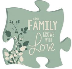 a puzzle piece with the words, our family grows with love and flowers on it