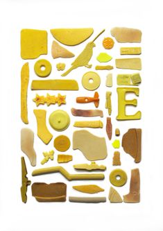 various shapes and sizes of food are displayed on a white surface