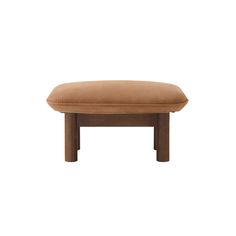 the foot stool is made from wood and has a tan cushion on top of it