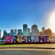 there is a large sign with the word baltimore painted on it in front of a cityscape