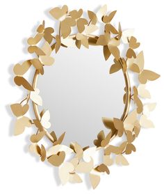 a mirror that has some leaves on it