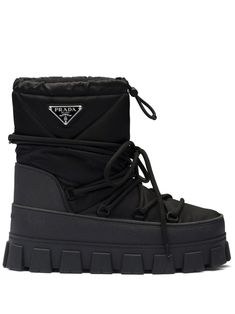 black recycled polyamide calf leather padded design enamel triangle logo round toe front lace-up fastening chunky rubber sole Trip Clothes, Apres Ski Boots, Black Snow Boots, Prada Collection, Prada Nylon, Ski Boots, Prada Men, Triangle Logo, Ski Trip