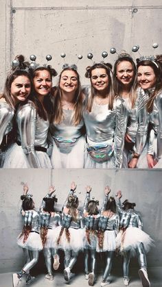 a group of girls dressed in silver posing for the camera