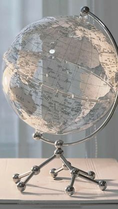 a glass globe sitting on top of a wooden table