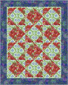 a red and green quilt with flowers on it