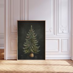 a christmas tree in a room with white walls and wood flooring on the side