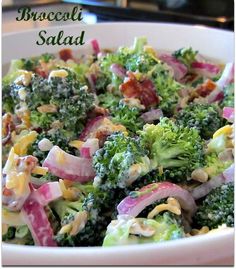 broccoli salad with bacon and onions in a white bowl