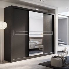 a modern bedroom with mirrored closet doors