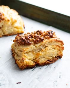 two pieces of bread sitting on top of a counter