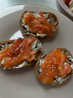 three pieces of bread with salmon on them