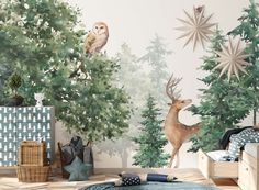 a bedroom decorated with trees and animals on the wall, including an owl sitting on top of a tree