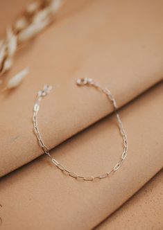 A delicate link chain that catches the light perfectly. Bracelet is adjustable from 6.5 - 7". Available in 14kt Gold Fill + Sterling Silver. Claire stacks it with our Pearl Bracelet. Cat pairs it with our Wander Cuff. Handmade in Eau Claire, WI. Our jewelry is handmade so each piece will be unique and may vary slightly from what is pictured. Copper Uses, Adornment Jewelry, Everyday Wear Jewelry, Jewelry Cleaner, Jewelry Case, 14kt Gold, Earring Necklace, Pearl Bracelet, Link Chain