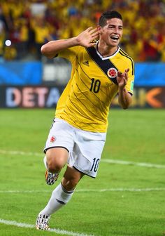 a soccer player is celebrating his goal on the field