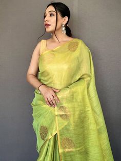 Nothing will be comparable when your beauty will be combined with this stunning tissue silk material light green saree beautified with jacquard zari weaving with motifs all over the borde work and having rich pallu. This awesome woven silk light green saree comes with a golden color plain blouse in silk fabric. This stunning traditional woven silk saree is 5.50 meters long and comes with fully unstitched 1.00 meters blouse material. Update your clothing style as per trend with this beautiful sil Festive Raw Silk Pre-draped Saree, Designer Cotton Silk Saree With Dori Work, Designer Tussar Silk Pre-draped Saree, Festive Pre-draped Chanderi Saree, Transitional Slub Silk Pre-draped Saree, Pre-draped Raw Silk Saree, Navratri Cotton Silk Saree With Dori Work, Designer Pista Green Pre-draped Cotton Silk Saree, Transitional Green Pre-draped Saree With Self Design