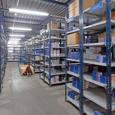 an empty warehouse filled with lots of shelves