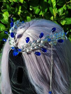 Dive into the ethereal world of the Water Priestess Tiara! This enchanting headpiece features a silver tiara base adorned with captivating blue round and teardrop beads. Delicate chains dangle gracefully, each adorned with additional beads, creating a mesmerizing cascade. At the heart of it all, a sparkling blue rhinestone takes center stage. Embrace the magic of the water element and make a statement with this elegant tiara, perfect for mystical ceremonies or fantasy-inspired events This tiara is perfect for a fantasy-themed ball or a festival, DnD or fairy cosplay. Embrace your inner fantasy enthusiast at magical festivals like Renaissance fairs, where you can embody the spirit of elven elegance. It also lends itself beautifully to elven-inspired weddings, adding a touch of enchantment t Water Priestess, Elf Headpiece, Elegant Tiara, Blue Tiara, Elven Tiara, Fantasy Accessories, Fantasy Ball, Fantasy Crown, Fairy Cosplay