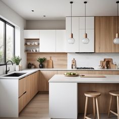 a kitchen with wooden cabinets and white counter tops, two stools in front of the sink