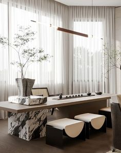 an elegant dining room with marble table and bench