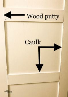 an arrow pointing to wood putty and caulk on a white cabinet door