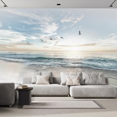 an ocean scene with birds flying in the sky and waves crashing on the beach wall mural