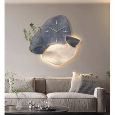 a living room filled with furniture and a large clock on the wall above it's face