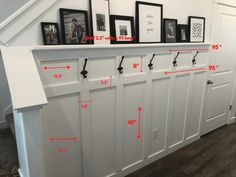 a white wall with some pictures on top of it and measurements for the door frame