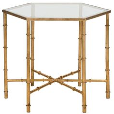 a gold bamboo and glass side table with an octagonal top, on a white background