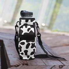 Quench your thirst for style and functionality with our Cow Print Water Bottle Carrier - the perfect accessory for staying hydrated on the go! 🐄 Chic Cow Print Design: Make a statement with your hydration gear! Our water bottle carrier features a charming cow print pattern in classic black and white, adding a touch of whimsy and flair to your daily routine. 💧 Convenient and Versatile: Designed with convenience in mind, our water bottle carrier is perfect for keeping your favorite beverage close at hand wherever you go. Whether you're hitting the gym, going for a hike, or running errands around town, this carrier ensures you stay hydrated in style. 🌟 Durable and Reliable: Crafted from high-quality materials, our water bottle carrier is built to withstand the rigors of everyday use. The s Cow Print Water Bottle, Water Bottle For School, Bottle For School, Cow Print Pattern, Cow Print Design, Printed Water Bottles, Water Bottle Carrier, Water Bottle Covers, Staying Hydrated