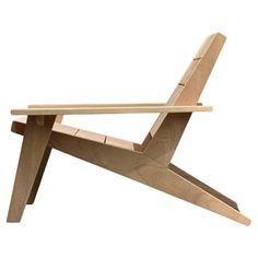 a wooden chair that is made out of wood and has one leg extended to the side