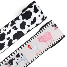 two black and white hair ties with farm animals on them, one has a pink cow