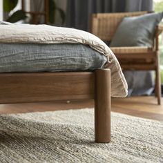 a bed sitting on top of a wooden frame