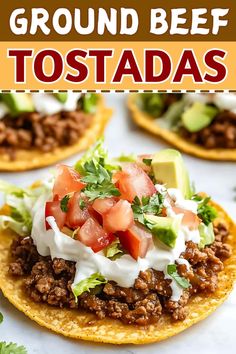 ground beef tostadas with avocado, tomatoes and sour cream on top