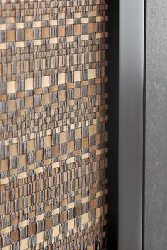 a close up view of a wall with woven material on the outside and in the inside