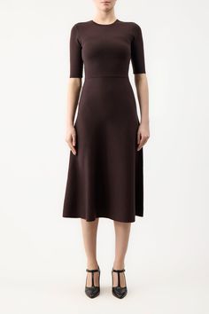 The Seymore Dress is in cashmere wool and silk blend with a crew neckline, A-line silhouette, and elbow sleeves. It is completed with a full midi-length skirt.Details:90% Merino Wool, 10% CashmereInternational sizingMade from Italian yarnsSize and Fit: Fits true to size. Model is 5'11"" and wearing a size S. Poncho Cardigan, Cape Sweater, Suede Tops, Gabriela Hearst, Satin Bags, Yarn Sizes, Midi Length Skirts, Silk Wool, Knit Midi