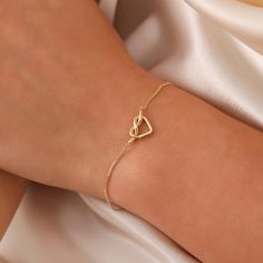 Tiny Knot Bracelet, 14K Solid Gold Heart Knot Bracelet, Dainty initial Unique Love Bracelet, Handmade 14K Gold Knot Bracelet, Great Gift For Her, Summer Jewelry, Anniversary Bracelet, Birthday Gift, Christmas Gift, Solid Gold Bracelet, Minimalist Gold Bracelet, Wedding Bracelet, Valentine's Day Gift "Material: SOLİD GOLD (No Gold Filled Or No Gold Plated)" "KARAT: 14K (585) "Bracelet Length: 11 MM "Bracelet Width: 7,5 MM "Available Gold Color: (Yellow Gold, White Gold, Rose Gold) "The certificat Minimalist Yellow Gold Charm Bracelet For Anniversary, Elegant Gold Heart-shaped Name Bracelet, Minimalist Yellow Gold Heart Bracelet For Anniversary, Elegant Name Bracelet With Heart Charm As Gift, Elegant Name Bracelet With Heart Charm For Gift, Elegant Adjustable Heart Name Bracelet, Elegant Adjustable Heart-shaped Name Bracelet, Elegant Open Heart Bracelets, Elegant Yellow Gold Open Heart Bracelet