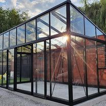 the sun shines through the glass in this greenhouse