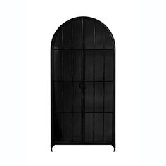 a tall black metal door with an arched design on the top and bottom panel, in front of a white background