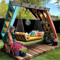 an outdoor swing bed with colorful pillows on it