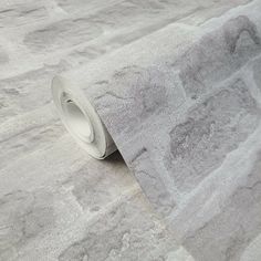 a roll of grey marble paper on top of a table