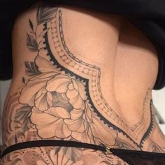 the back of a woman's thigh with flowers on it