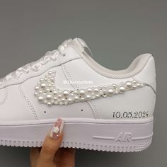 Elevate your wedding look with our Nike Air Force 1 Pearl Custom shoes. These stylish sneakers feature a unique pearl design that adds a touch of elegance to any outfit. Stay comfortable and fashionable all day with the iconic Air Force 1 silhouette. Perfect for the modern bride who wants to make a statement on her special day. ★ Brand new with box ★ Each pair is unique and one of a kind ★ Each pair is personally handmade, painted with high quality Angelus. ★ Leather acrylic paint. Topped with a Air Forces Design, Brides Sneakers Wedding, Wedding Shoes Air Force, Bride Nikes Bridal Shoes, Bride Nike Air Force, Pearl Air Force 1, Custom Bride Shoes, Bridal Air Force Ones, Bride Air Force Ones