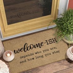 a welcome mat with the words,'welcome fish happens who you are and how long you stay '