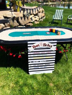 a table that has been made to look like a boat in the water with some writing on it