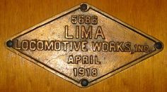 a plaque on the side of a wooden door that says loommotive working