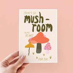 a hand holding up a card with mushrooms on it that says, there's so mushroom - room in my heart for you