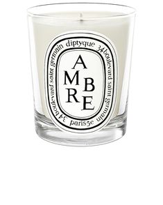 an ambre candle is shown on a white background